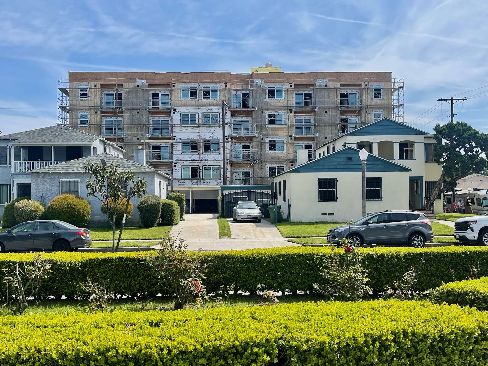 A dense urban area encroaching on single-family homes.